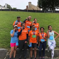 Team with medals on hill