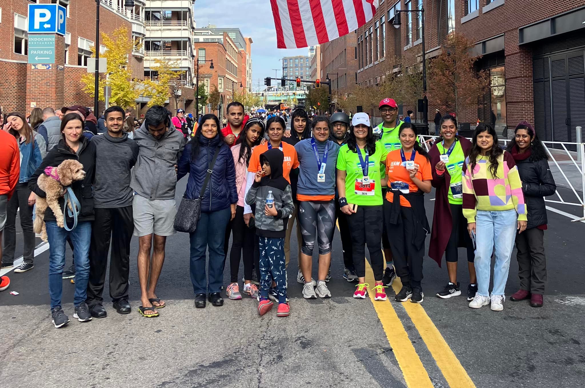 Large group on race street with American flag