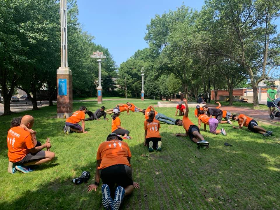 Stretching at bench by river